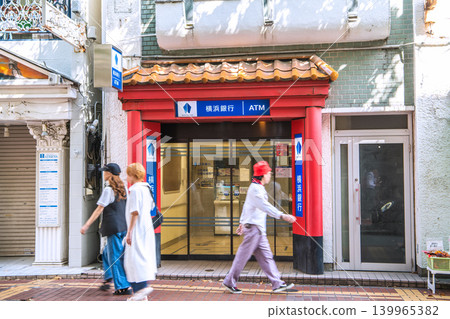 A new urban landscape of Yokohama, Japan. Yokohama Bank on West Gate Street in Chinatown. Greek-style shops line the left side. = May 12 A new urban landscape of Yokohama, Japan. Yokohama Bank on West Gate Street in Chinatown. Greek-style shops line the left side. = May 12 139965382