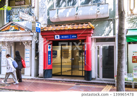 A new urban landscape of Yokohama, Japan. Yokohama Bank on West Gate Street in Chinatown. Greek-style shops line the left side. = May 12 A new urban landscape of Yokohama, Japan. Yokohama Bank on West Gate Street in Chinatown. Greek-style shops line the left side. = May 12 139965478