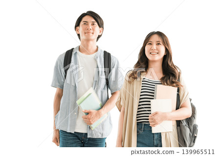 Students holding textbooks and notebooks; male and female university students (campus life, lovers, couples) 139965511