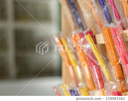 Showcase contains large assortment of aroma sticks Showcase contains large assortment of aroma sticks 139965562