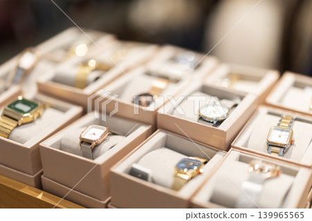 Wristwatches displayed in boxes inside accessories store Wristwatches displayed in boxes inside accessories store 139965565