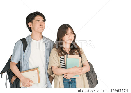Students holding textbooks and notebooks; male and female university students (campus life, lovers, couples) 139965574