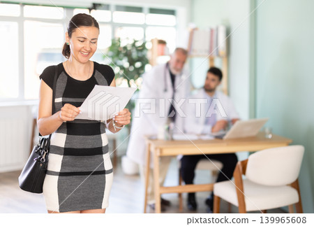 Positive outcome of medical problem, joyful woman client of medical institution. Positive outcome of medical problem, joyful woman client of medical institution. 139965608