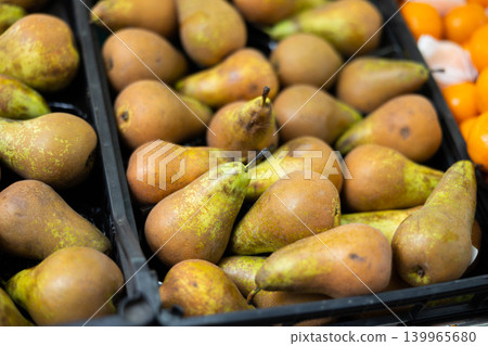 Sweet pear laid out in a container at the market Sweet pear laid out in a container at the market 139965680