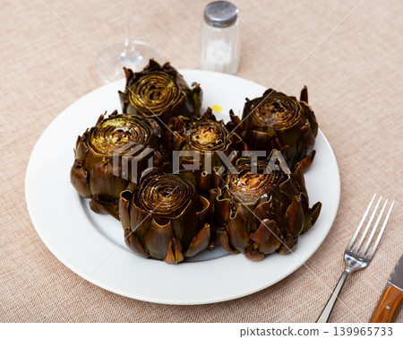 Fried or baked artichokes are dietary dish of Mediterranean cuisine 139965733