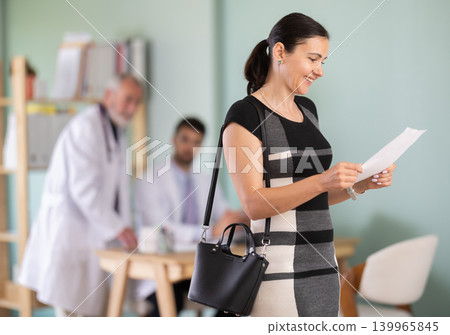 Positive outcome of medical problem, joyful woman client of medical institution. Positive outcome of medical problem, joyful woman client of medical institution. 139965845