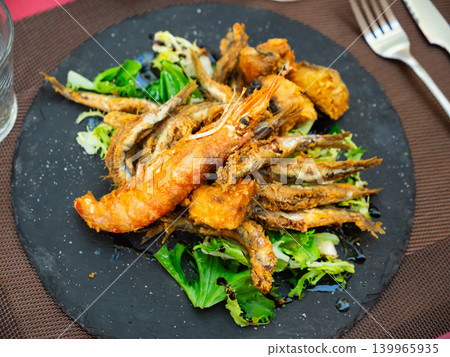 Grilled seafood and fish are specialty at coastal restaurant Grilled seafood and fish are specialty at coastal restaurant 139965935