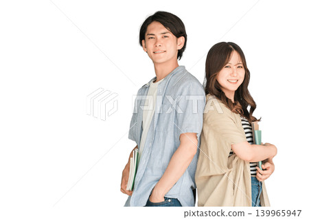 Students holding textbooks and notebooks; male and female university students (campus life, lovers, couples) Students holding textbooks and notebooks; male and female university students (campus life, lovers, couples) 139965947