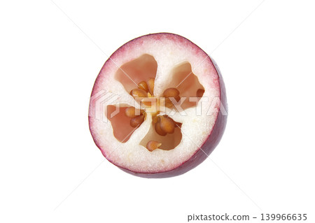 Close-up macro view of a single ripe cranberry cut in half showing seeds and juicy pulp Close-up macro view of a single ripe cranberry cut in half showing seeds and juicy pulp 139966635