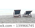Beach chairs are placed on the sand by the sea. 139966745