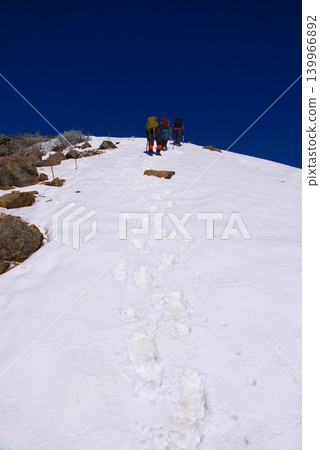 Nishitengu and climbers on Mt. Tengu in the Yatsugatake Mountains of Nagano Prefecture 139966892