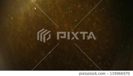 Twinkle blur confetti. Flare glimmer. Yellow gray mixing flow. Golden shimmering light color particles on dark abstract background. Twinkle blur confetti. Flare glimmer. Yellow gray mixing flow. Golden shimmering light color particles on dark abstract background. 139966970
