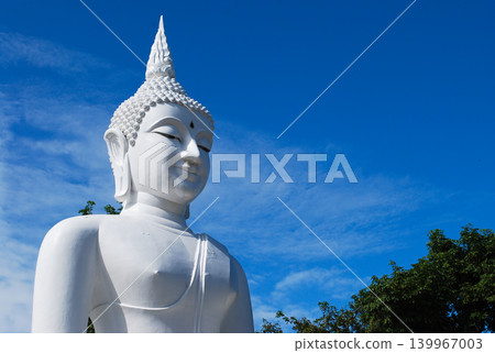 White Buddha statue with clear blue sky background in Thailand. White Buddha statue with clear blue sky background in Thailand. 139967003