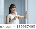 Young woman drinking water 139967495