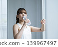 Young woman drinking water 139967497