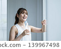 Young woman drinking water 139967498