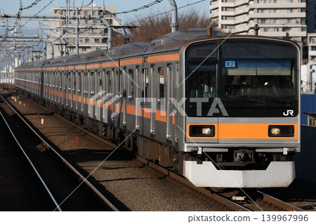 A Chuo Rapid Line 209 series 1000 series train, set Tota 82, entering Musashi-Sakai Station. A Chuo Rapid Line 209 series 1000 series train, set Tota 82, entering Musashi-Sakai Station. 139967996