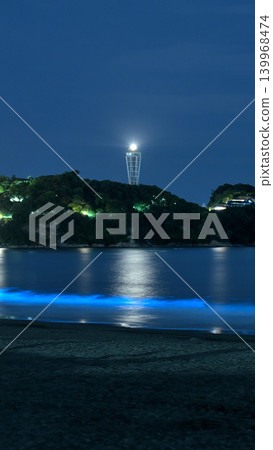 The night view of Shonan's sea and Enoshima, illuminated by moonlight, is a fantastical scene with bioluminescent plankton glowing blue. The night view of Shonan's sea and Enoshima, illuminated by moonlight, is a fantastical scene with bioluminescent plankton glowing blue. 139968474