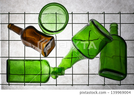 Three green empty bottles on a gray background 139969004