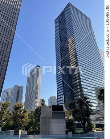 A cluster of buildings looking up at the blue sky in Shinjuku, Tokyo. 139969380
