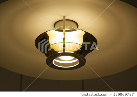 It is a lit dining table lamp. It is a lit dining table lamp. 139969757