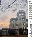 The Hiroshima Atomic Bomb Dome, a World Heritage Site, stands against the twilight sky. 139969817