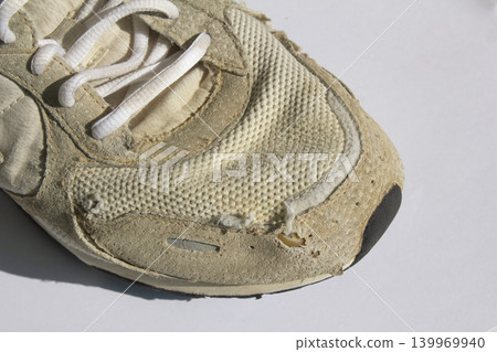 It is an old sneaker. It is an old sneaker. 139969940