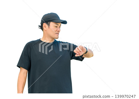 A middle-aged man in sportswear uses a smartwatch for health management and healthcare. A middle-aged man in sportswear uses a smartwatch for health management and healthcare. 139970247
