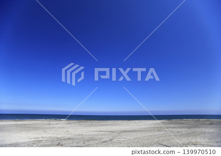 A clear blue sky, the sea, and a sandy beach. A clear blue sky, the sea, and a sandy beach. 139970510