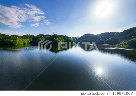 Early summer at Nunome Dam: The blue sky and path of light reflected on the lake's surface, which is filled to the brim ⑧ Early summer at Nunome Dam: The blue sky and path of light reflected on the lake's surface, which is filled to the brim ⑧ 139971007
