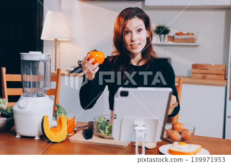 Woman preparing green smoothie in bright kitchen with fresh fruits and vegetables, healthy eating lifestyle moment in natural daylight Woman preparing green smoothie in bright kitchen with fresh fruits and vegetables, healthy eating lifestyle moment in natural daylight 139971953