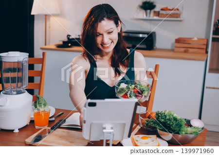 Woman preparing green smoothie in bright kitchen with fresh fruits and vegetables, healthy eating lifestyle moment in natural daylight Woman preparing green smoothie in bright kitchen with fresh fruits and vegetables, healthy eating lifestyle moment in natural daylight 139971960