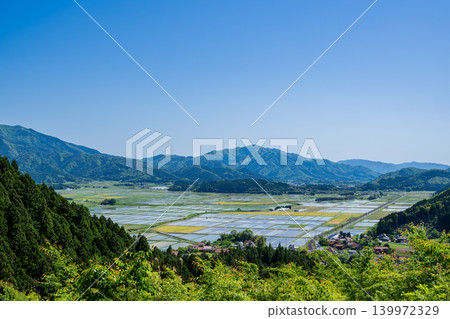A panoramic view of rice paddies and mountain ranges from Funahirayama Observatory. A panoramic view of rice paddies and mountain ranges from Funahirayama Observatory. 139972329