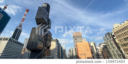 The streetscape around Ginza and Shimbashi, and the distinctive architecture of the Shizuoka Shimbun Tokyo Branch Office building. 139972403