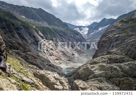 Glacial valley of Tre-La-Tete with rocky cliffs in Les Contamines-Montjoie, France Glacial valley of Tre-La-Tete with rocky cliffs in Les Contamines-Montjoie, France 139972431