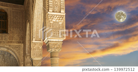 Columns in Islamic (Moorish)  style in Alhambra (against the sunset with the super moon), Granada, Spain 139972512