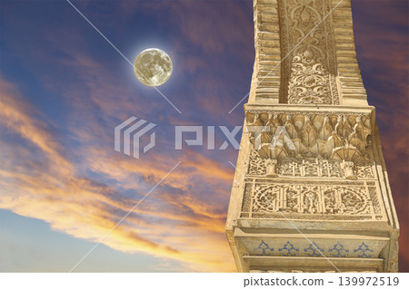Columns in Islamic (Moorish) style in Alhambra (against the sunset with the super moon), Granada, Spain Columns in Islamic (Moorish) style in Alhambra (against the sunset with the super moon), Granada, Spain 139972519