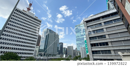 The office district and skyscrapers of Tokyo's Shinbashi and Shiodome area are bathed in blue sky. The office district and skyscrapers of Tokyo's Shinbashi and Shiodome area are bathed in blue sky. 139972822