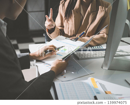 Accounting company provide finance and taxation planning for profitable cash flow, Auditor accountant working in office, analyze financial data and accounting record with calculator Accounting company provide finance and taxation planning for profitable cash flow, Auditor accountant working in office, analyze financial data and accounting record with calculator 139974075