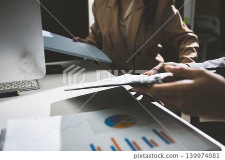 Accounting company provide finance and taxation planning for profitable cash flow, Auditor accountant working in office, analyze financial data and accounting record with calculator Accounting company provide finance and taxation planning for profitable cash flow, Auditor accountant working in office, analyze financial data and accounting record with calculator 139974081