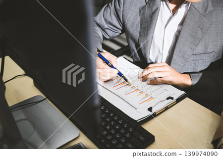 Accounting company provide finance and taxation planning for profitable cash flow, Auditor accountant working in office, analyze financial data and accounting record with calculator Accounting company provide finance and taxation planning for profitable cash flow, Auditor accountant working in office, analyze financial data and accounting record with calculator 139974090