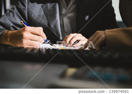 Accounting company provide finance and taxation planning for profitable cash flow, Auditor accountant working in office, analyze financial data and accounting record with calculator Accounting company provide finance and taxation planning for profitable cash flow, Auditor accountant working in office, analyze financial data and accounting record with calculator 139974091