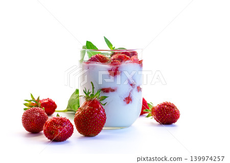 Summer berry dessert in glass on white backdrop Summer berry dessert in glass on white backdrop 139974257