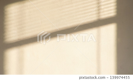 Shadow from window blinds on beige wall background warm minimal aesthetic interior concept light texture backdrop creative simple elegant design template copy space Shadow from window blinds on beige wall background warm minimal aesthetic interior concept light texture backdrop creative simple elegant design template copy space 139974455