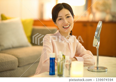 Middle-aged women doing their nighttime skincare routine 139974594