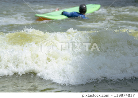 Surfers Riding Body boards in Waves 139974837