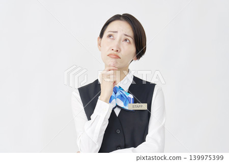 Troubled female staff member (receptionist/bank employee) - white background Troubled female staff member (receptionist/bank employee) - white background 139975399