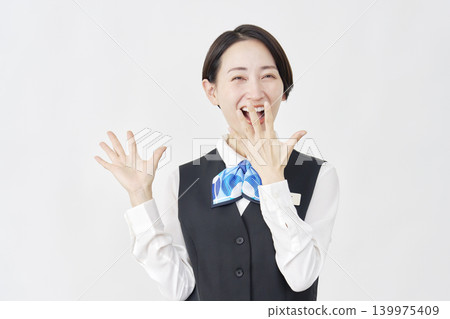 A female staff member with a surprised smile (receptionist/bank employee) against a white background. 139975409