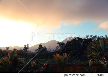 Sunset view with mountains and trees in Kintamani Bali Sunset view with mountains and trees in Kintamani Bali 139976086