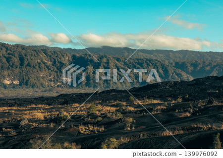 Volcanic landscape with green vegetation and hills 139976092